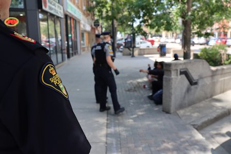 Officers in discussion with members of the public in the downtown area